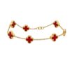 Elegant 14k Gold Vancliff Bracelet with striking red accents, a luxurious statement piece.