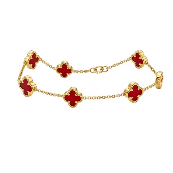 Elegant 14k Gold Vancliff Bracelet with striking red accents, a luxurious statement piece.