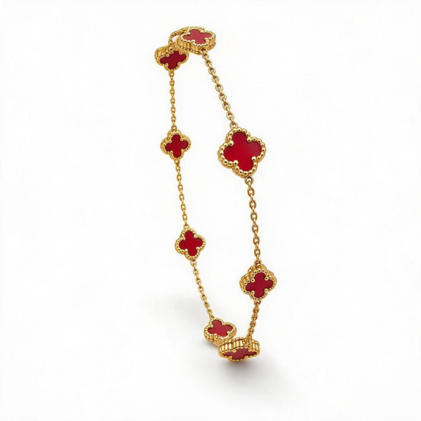 Elegant 14k Gold Vancliff Bracelet with striking red accents, a luxurious statement piece.