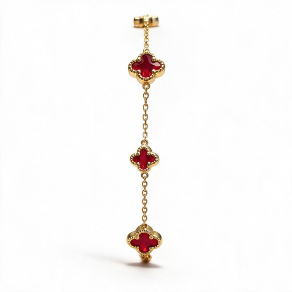 Elegant 14k Gold Vancliff Bracelet with striking red accents, a luxurious statement piece.